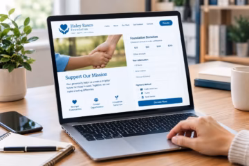 Laptop displaying a Haley Rasco Foundation donation form on a bright, modern home office desk space.